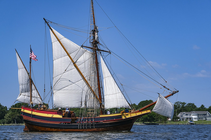 The ship Maryland Dove in the river, with sails unfurled.